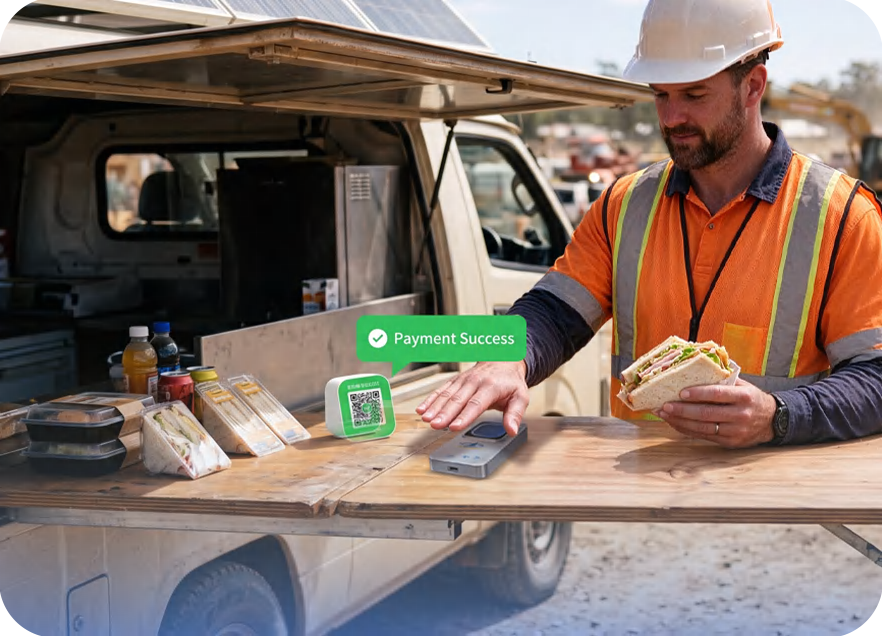 Workers charging a meal against their account at a mobile canteen van running the HF-PVBW3000
